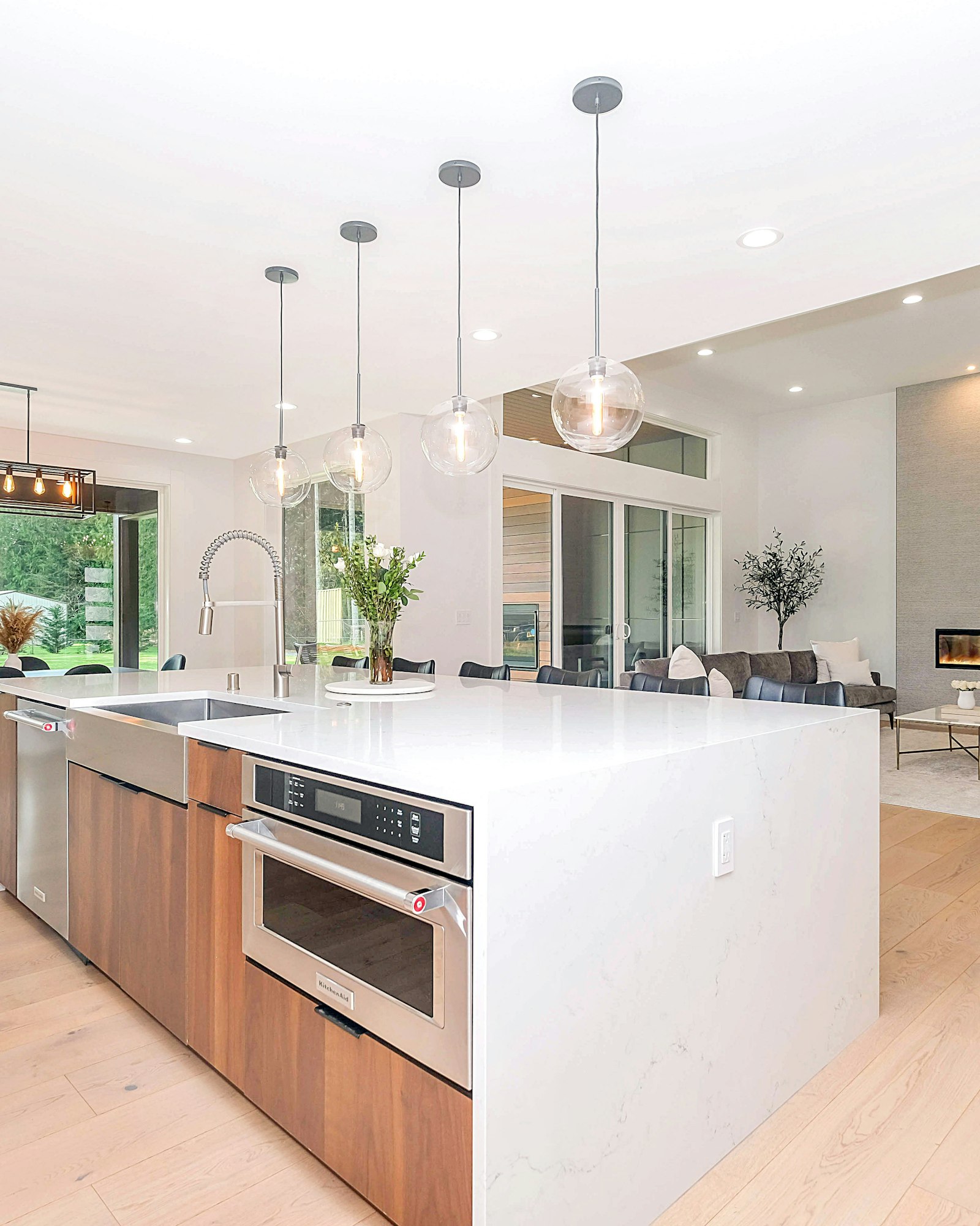 Finished modern kitchen with island and pendant lighting